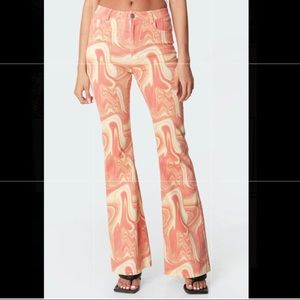 Edikted Ripple Flare Jeans: Pink and Orangle swirl color. Size medium